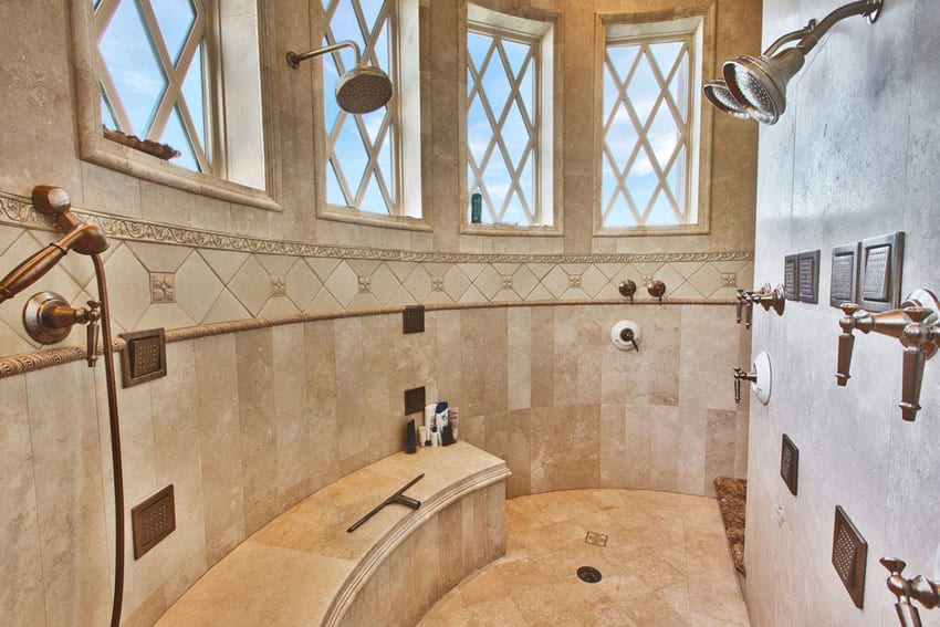 Large luxury travetine shower with three showerheads