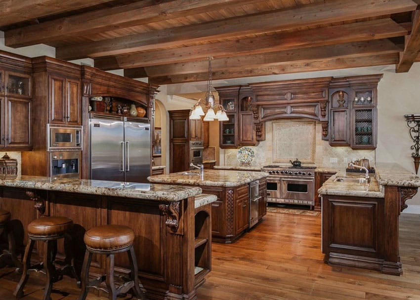 Kitchen with wood flooring, hanging pendant lights and wood beams