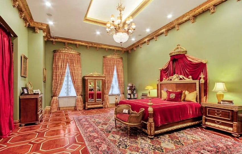 Majestic bedroom with gold and red color decor and ornate moldings