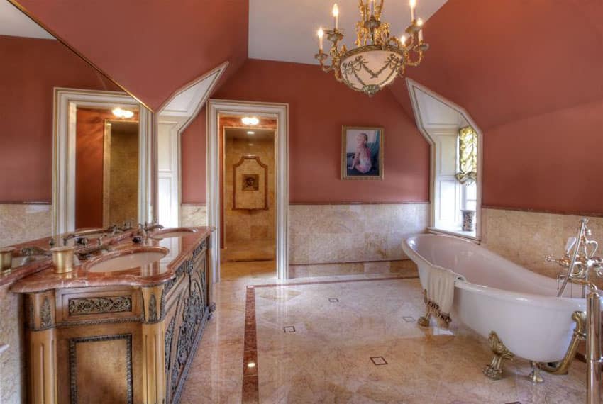 Bathroom with red walls, weathered wood cabinets and two-tone marble flooring