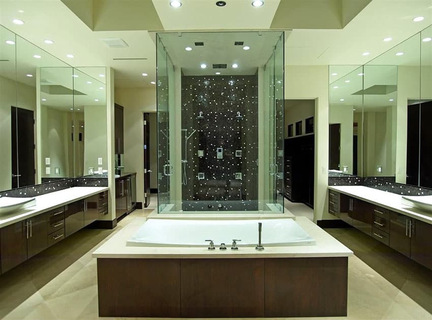 Master bathroom with dark brown vanities and black tile shower
