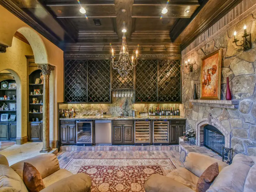 Bar with wine storage racks and sunken pit with couch