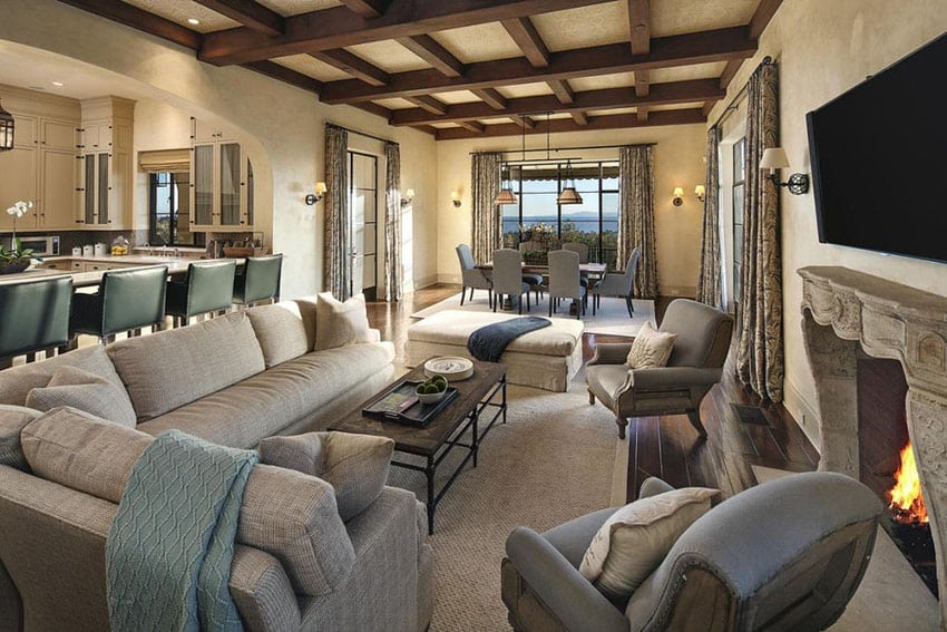 Room with open plan layout, fireplace with ornate manlte and boxed ceiling