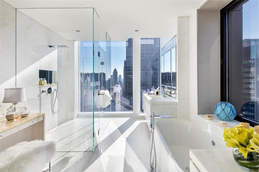 Modern bathroom with city view and frameless shower door