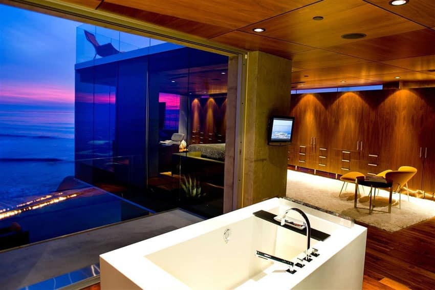 Modern bathroom with ocean view from acrylic bathtub