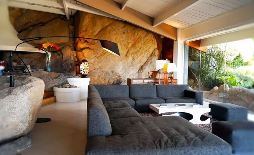 Modern living room design with real boulder wall