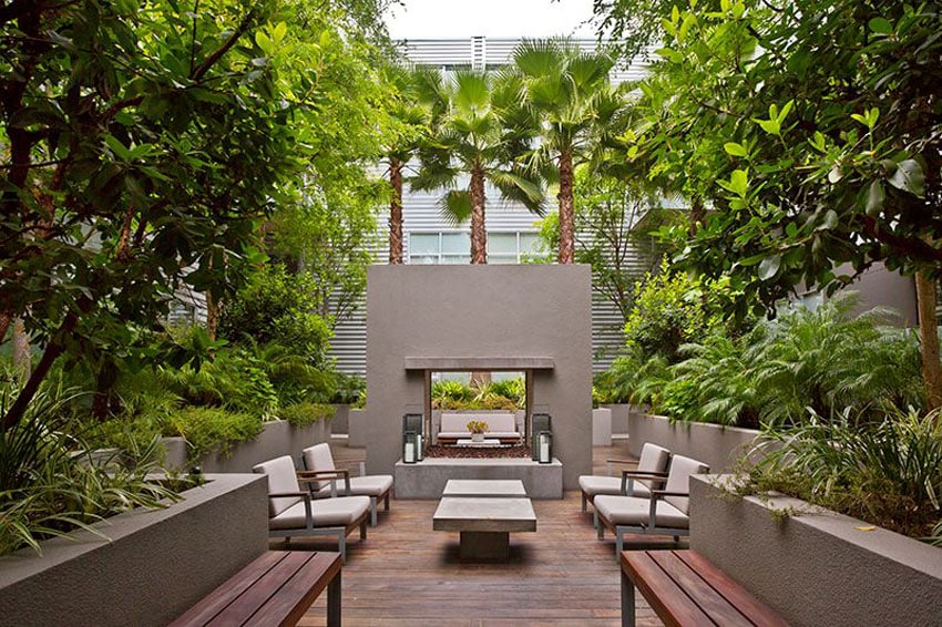 Modern patio design with lush landscaping