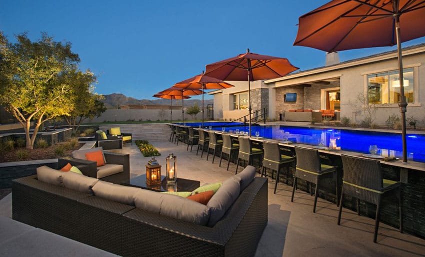 Modern patio with bar facing swimming pool