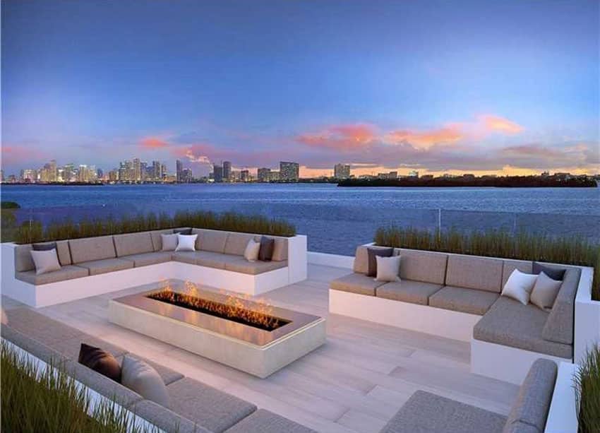 Modern patio with firepit and waterfront views of Miami