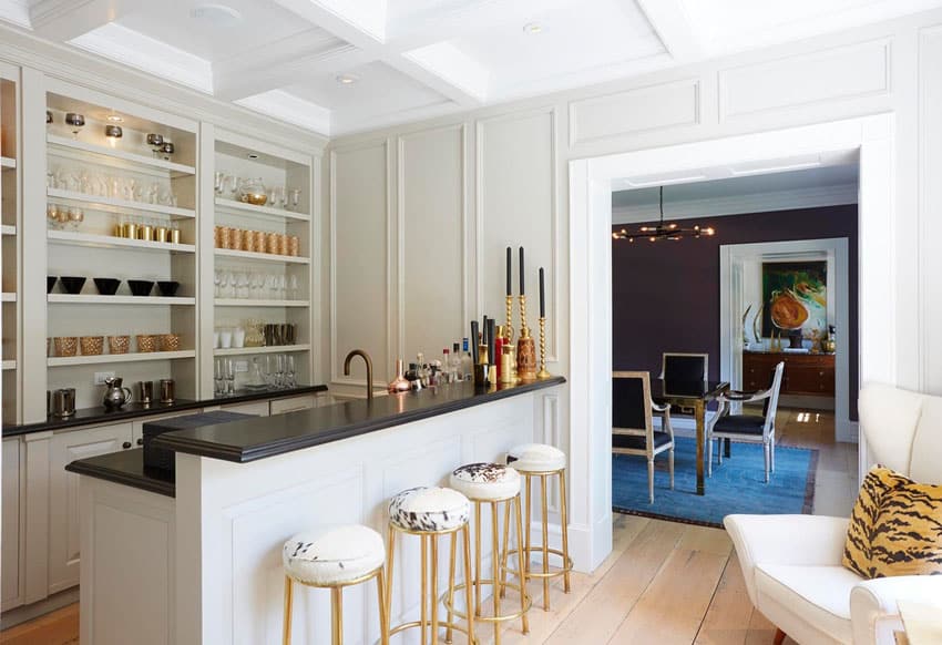 Bar with gold, white and black themes with open shelving