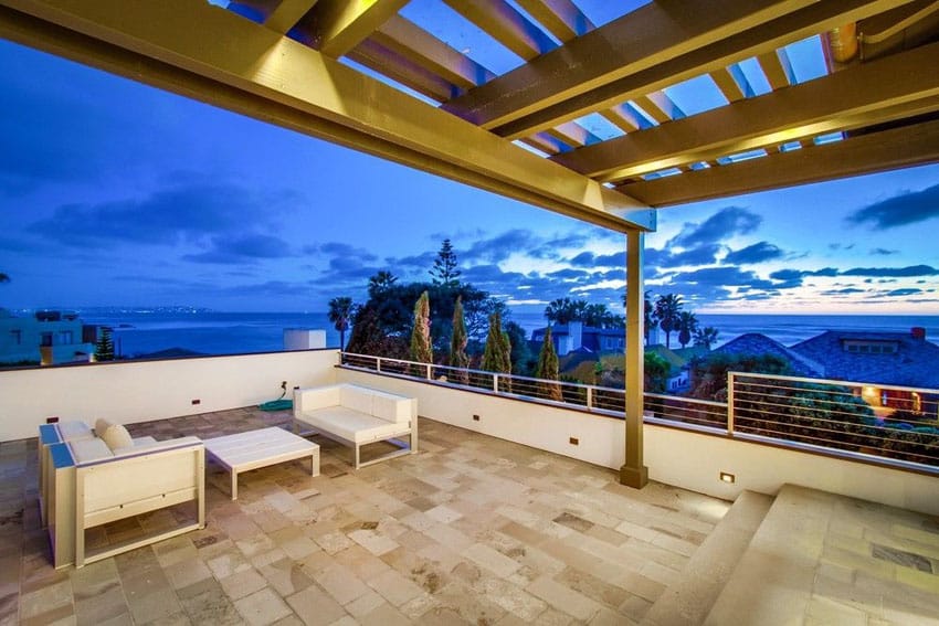 Ocean view patio with white outdoor furniture