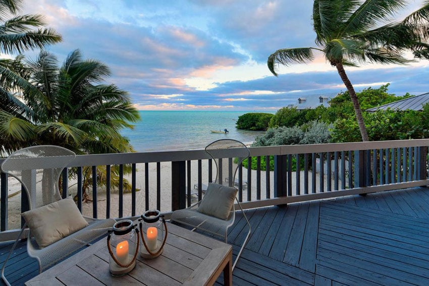 Oceanfront wood deck in florida with tropical palm trees