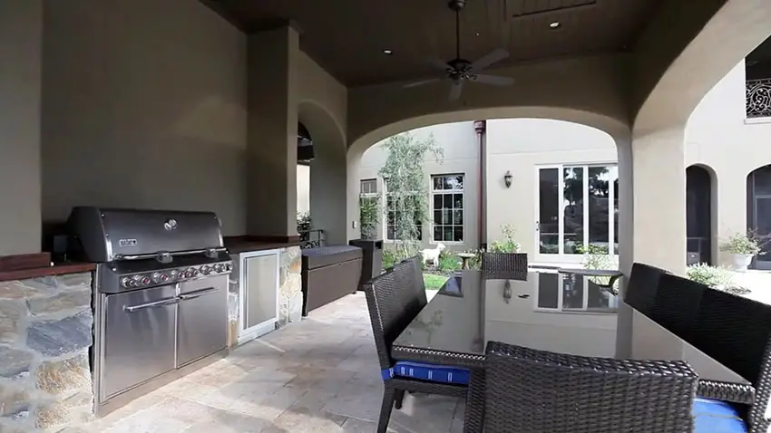 Outdoor kitchen with covered patio at custom estate home