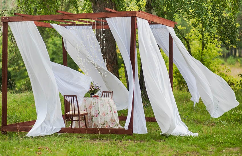 Pergola gazebo with white curtains 