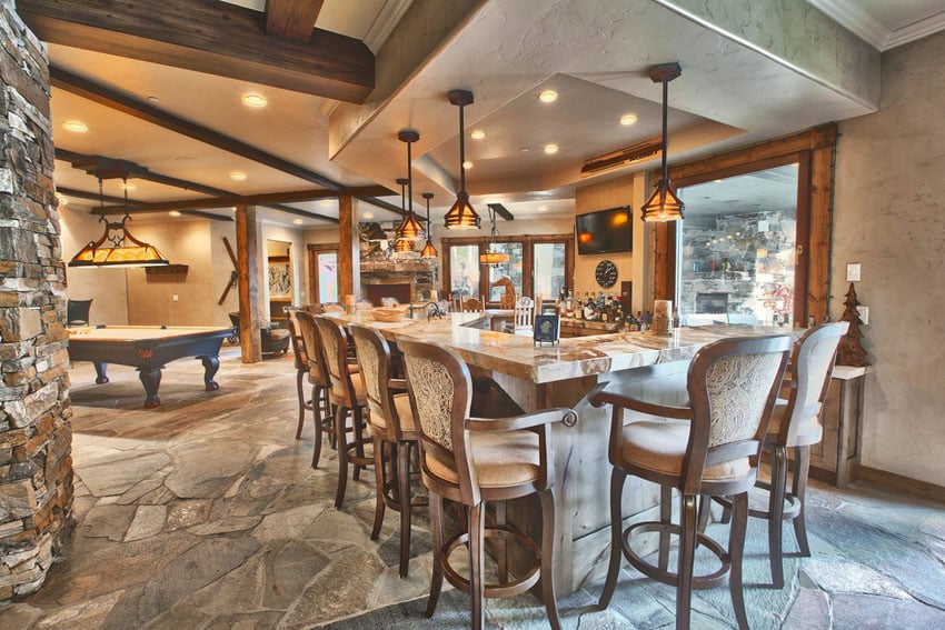 Game room with stone pillars and wood beams