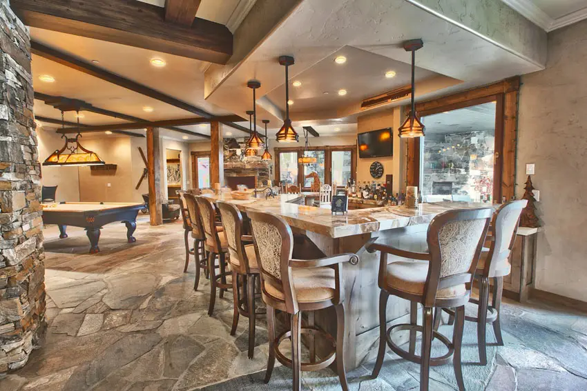 Game room with stone pillars and wood beams