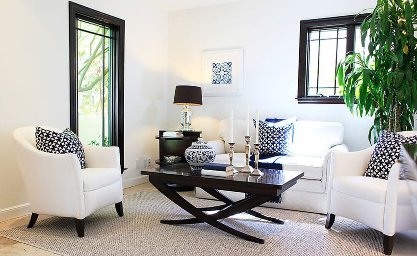 Small contemporary living room with white club chairs and sofa