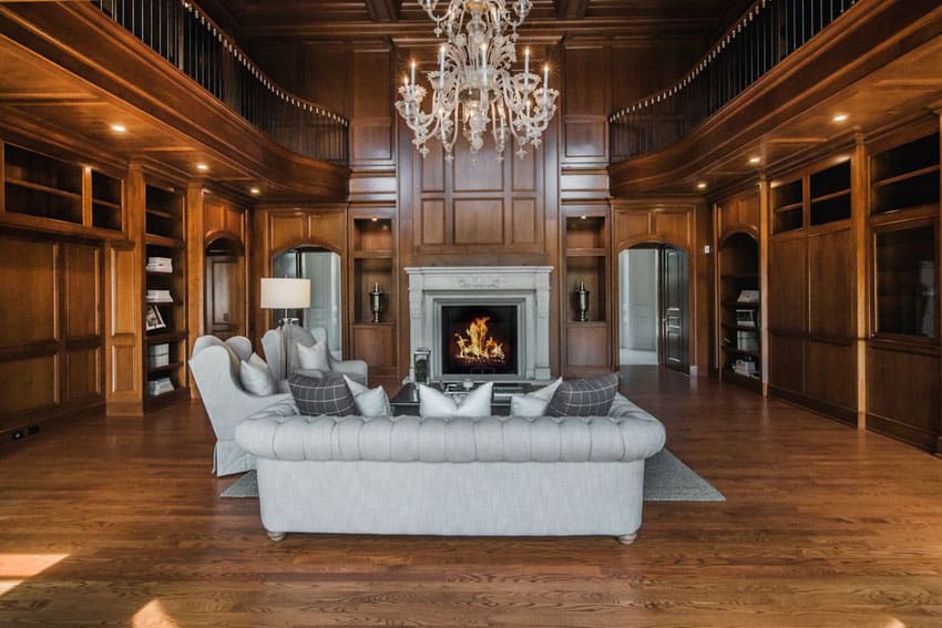 Room with majestic chandelier and second story balcony