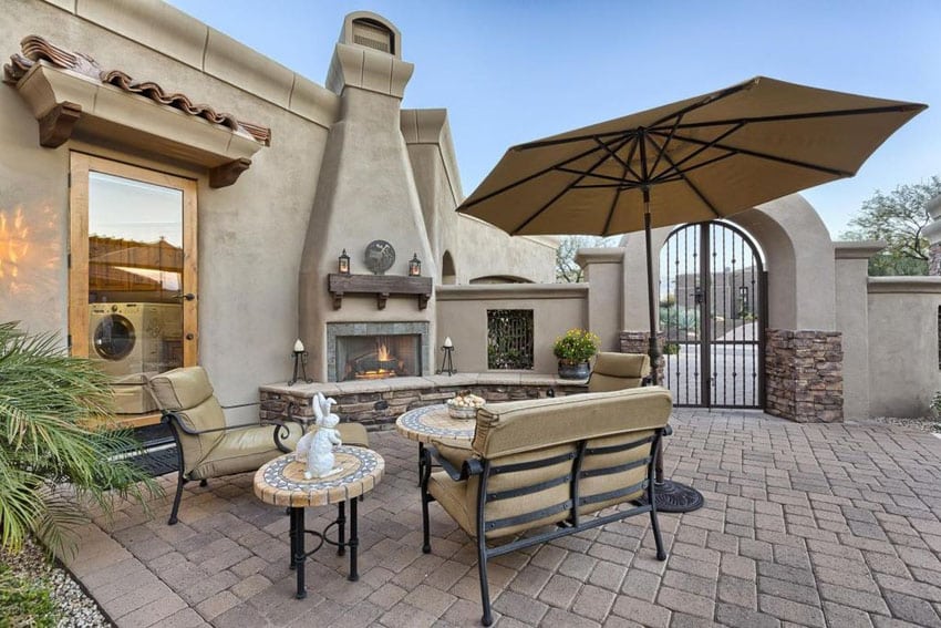 Southwestern style patio with outdoor fireplace