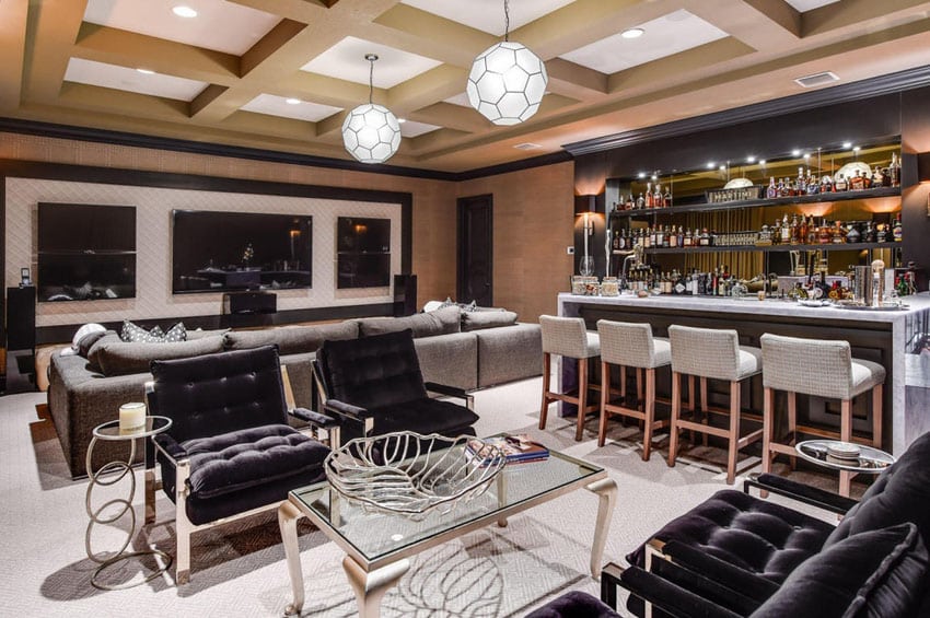 Stylish home bar with lounge seating and marble counters