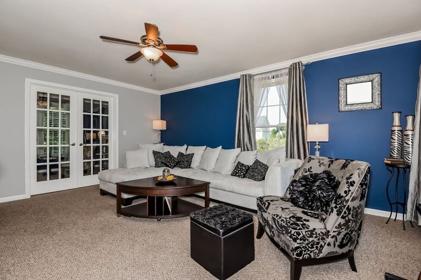 Traditional living room with blue accent wall and sectional couch