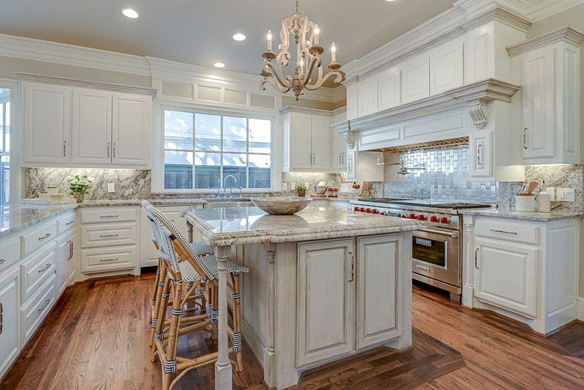 Traditional kitchen with white cabinets aspen white granite countertop and breakfast bar