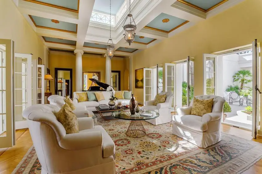 Walls with mustard paint and ceiling with blue and gold accent