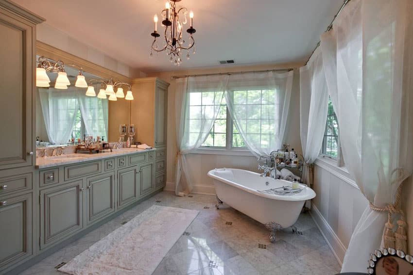 Bathroom with cast iron clawfoot tub and carrara marble counter