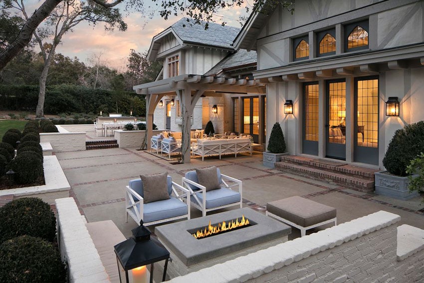 Traditional patio at luxury home with firepit and pergola