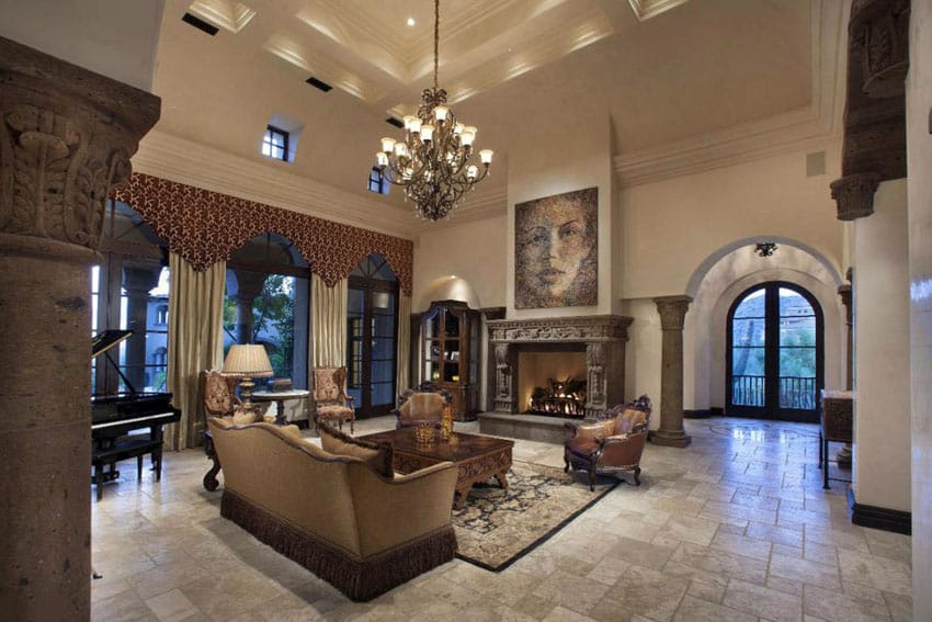 Traditional luxury living room with arched windows decorative fireplace and elegant chandelier