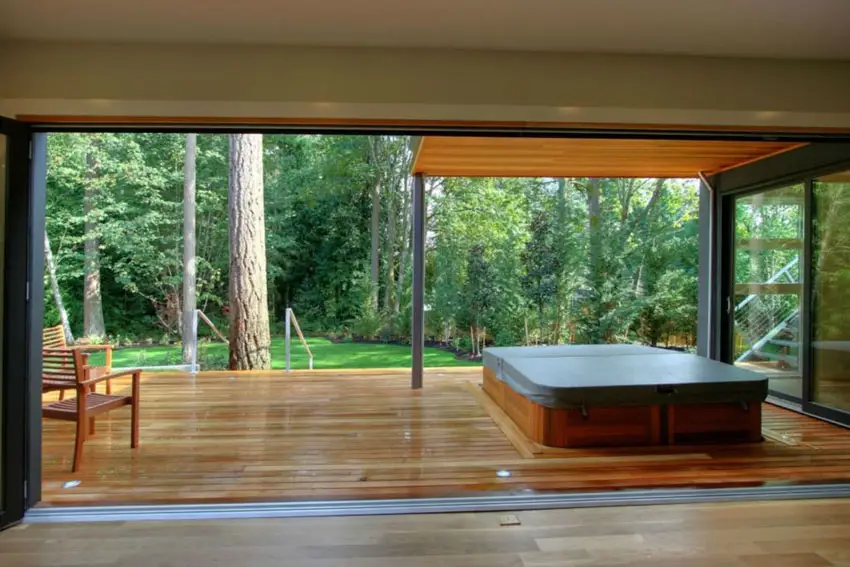 View of wood deck from bedroom through wide doorway