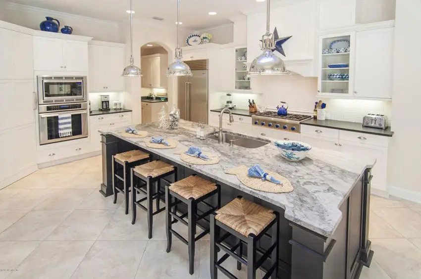 Kitchen with black soapstone counters and carrara marble island