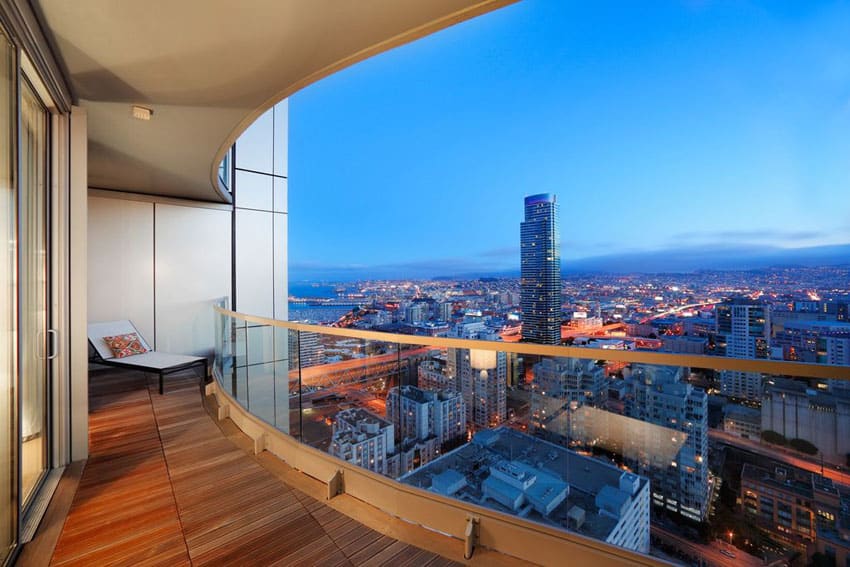 Wood deck in penthouse apartment with city views