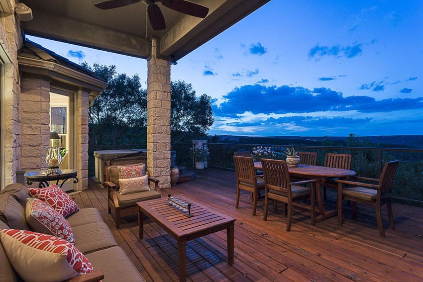 Wood deck with outdoor dining table and hot tub