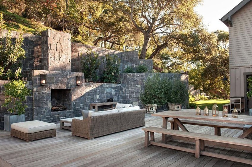 Wood deck with stone fireplace and picnic table