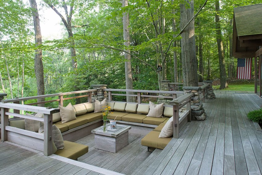 Wood deck with sunken sitting area in backyard of house