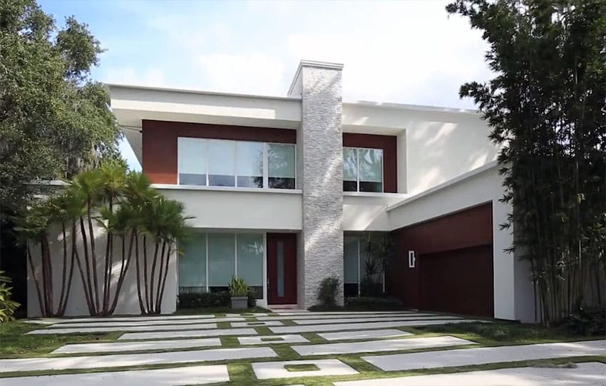 Custom 2 story modern house design with concrete and grass driveway