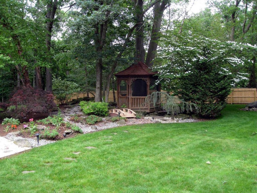 Backyard garden with small wood octagon gazebo