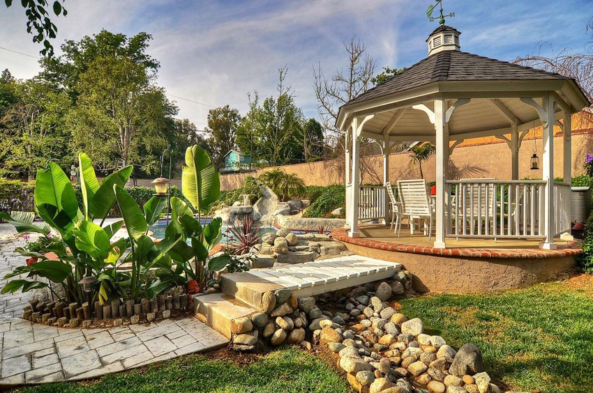 12 ft vinyl octagon gazebo in backyard next to swimming pool