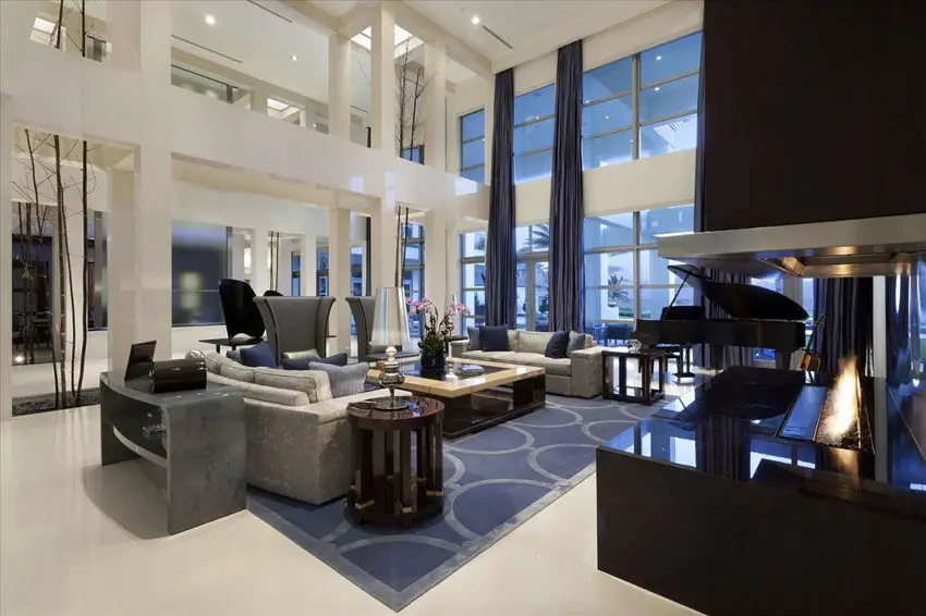 Beautiful luxury living room with modern rectangular fire pit and high ceilings