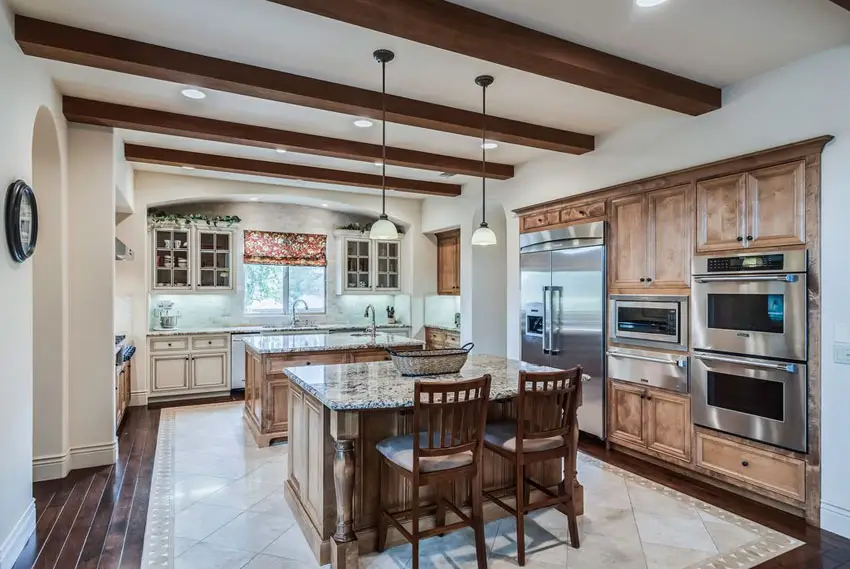 Beautiful traditional kitchen with decorative woodwork and wood plank floors