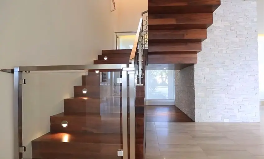 Beautiful wood staircase leading to second story of modern home