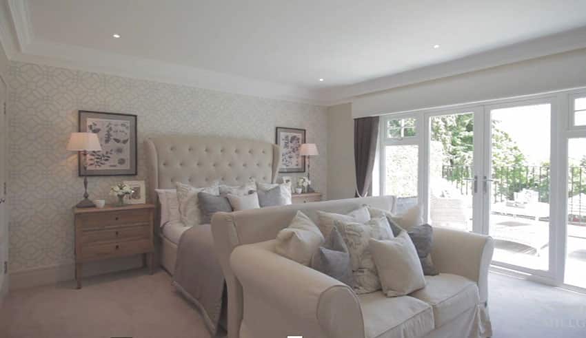 Bright bedroom with tufted headboard and bed seat