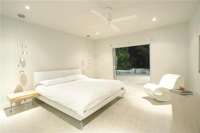 Bright white modern bedroom with hanging lights