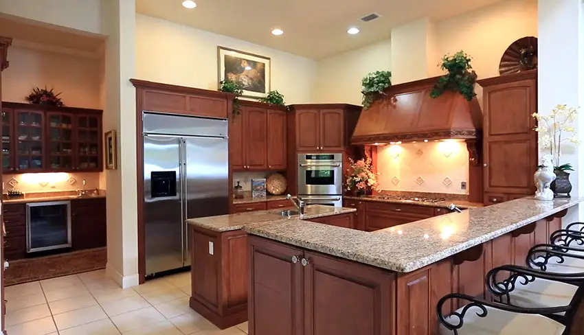 Chefs kitchen with 6 burner gas range and dining peninsula
