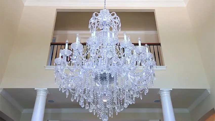 Close up view of beautiful hanging chandelier to upstairs balcony
