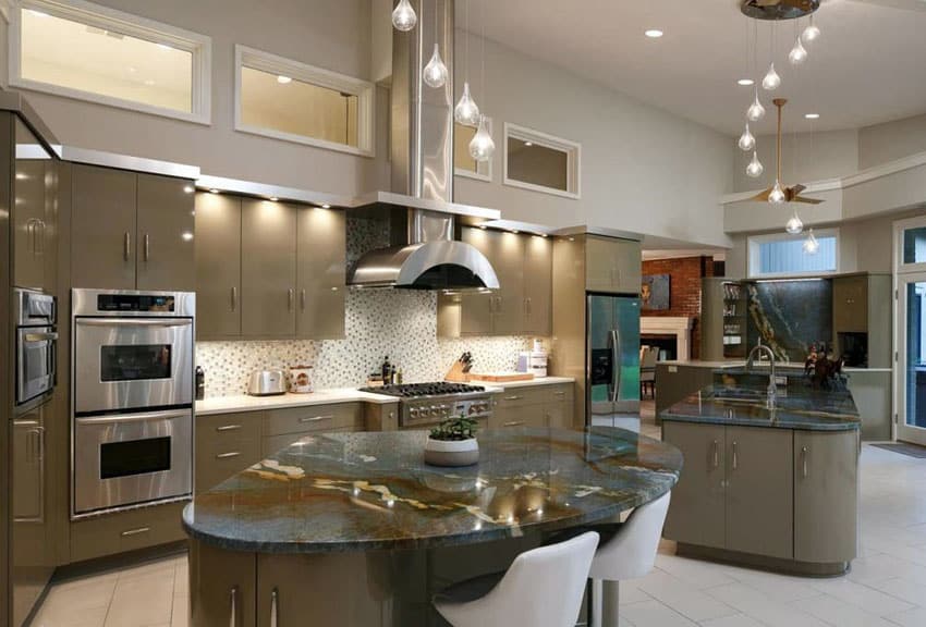 Contemporary kitchen with angola black counter and clear glass wide pendant lighting