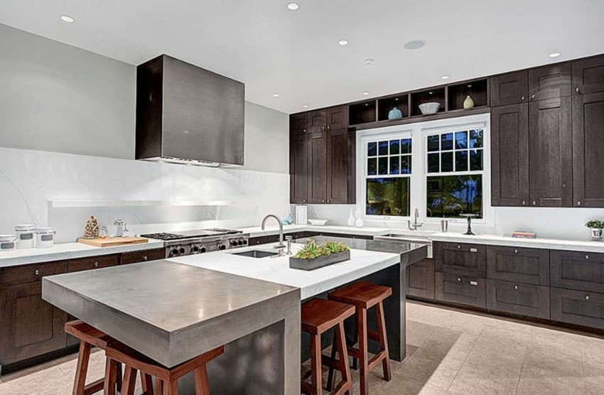 Contemporary kitchen with marble counter island with saddle stool seating