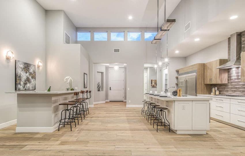 Kitchen with open concept design and islands with several seats