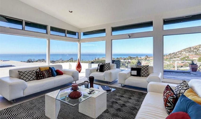 Contemporary white furniture living room with expansive ocean views